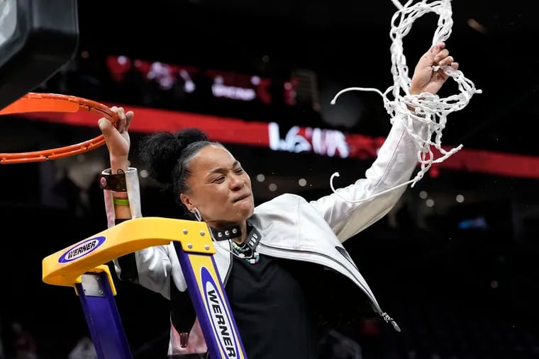 South Carolina head coach Dawn Staley cuts down the net after her team defeated Iowa in the Final Four college basketball championship game in the women's NCAA Tournament. Few sports monuments in Philadelphia honor individual female athletes, Dave Caldwell writes.