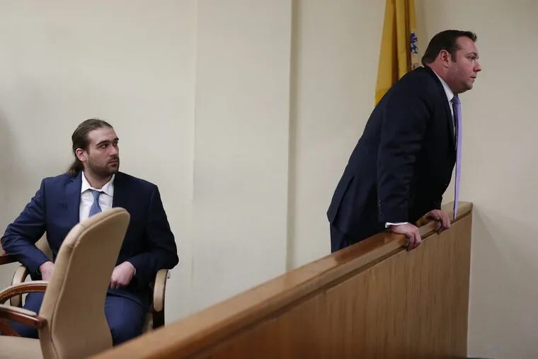 David “D.J.” Creato Jr. looks on as his defense attorney, Richard J. Fuschino Jr., talks to   members of the Creato family at the end of the day at Creato’s trial in Camden, New Jersey, on Tuesday, May 23, 2017. Jury deliberation began later in the day.