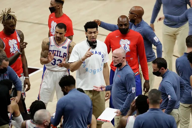 Injured forward Danny Green (center) talks to his Sixers teammates during a timeout in Game 6 of their second-round playoff series against Atlanta back on June 18.