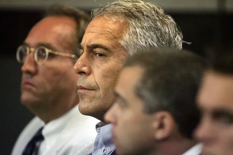 Jeffrey Epstein, center, appears in court in West Palm Beach, Fla., in July 2008.  At the center of Epstein's secluded New Mexico ranch sits a sprawling residence the financier built decades ago, complete with plans for a 4,000-square-foot (372-square-meter) courtyard, a living room roughly the size of the average American home and a nearby private airplane runway.