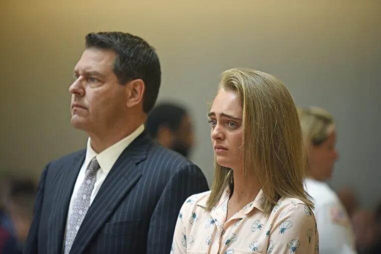 Michelle Carter and her attorney Joseph Cataldo stand to hear Judge Lawrence Moniz announce his verdict in the involuntary manslaughter case.
