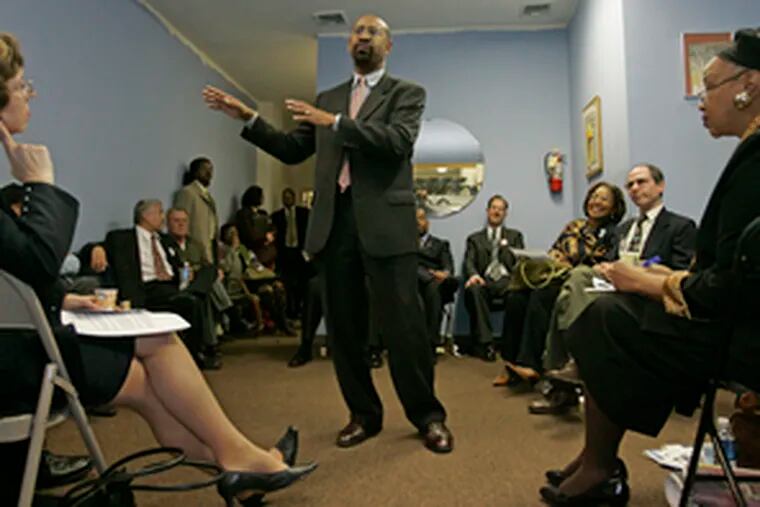 Michael Nutter campaigns at the African American United Fund Conference Center. His platformis drawing white voters in the city, while white millionaire Tom Knox appeals to the black vote.