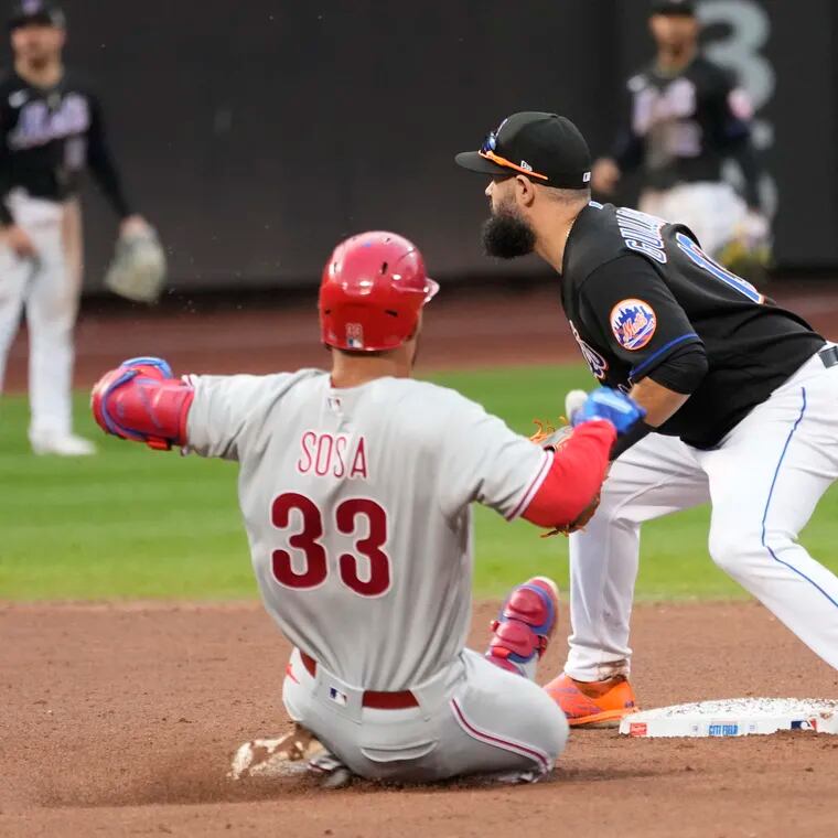 Phillies' Edmundo Sosa (33) slides safely into second past New York Mets second baseman Luis Guillorme during the eighth inning of the first game of their doubleheader on Saturday.
