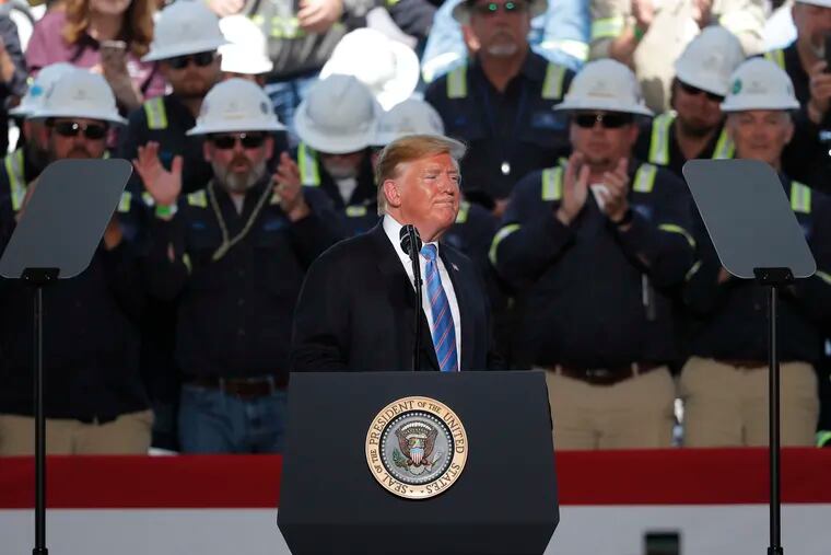 Workers applaud as President Donald Trump speaks at the Cameron LNG Export Terminal in Hackberry, La., Tuesday, May 14, 2019.