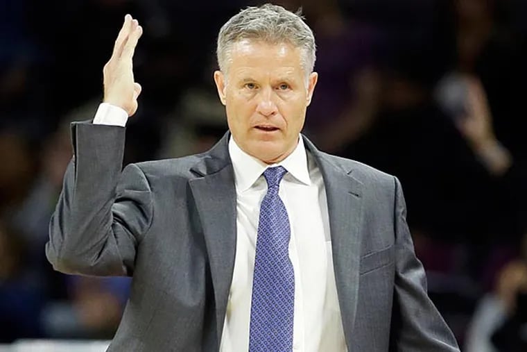 Philadelphia 76ers head coach Brett Brown gestures during the second
half of an NBA basketball game against the Detroit Pistons in Auburn
Hills, Mich., Thursday, Oct. 23, 2014. (Carlos Osorio/AP)