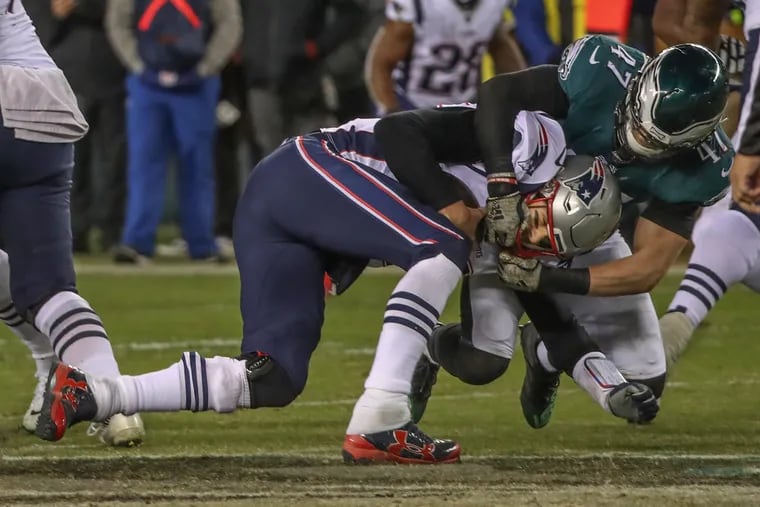 Eagles linebacker Nathan Gerry sacks Tom Brady on Sunday.