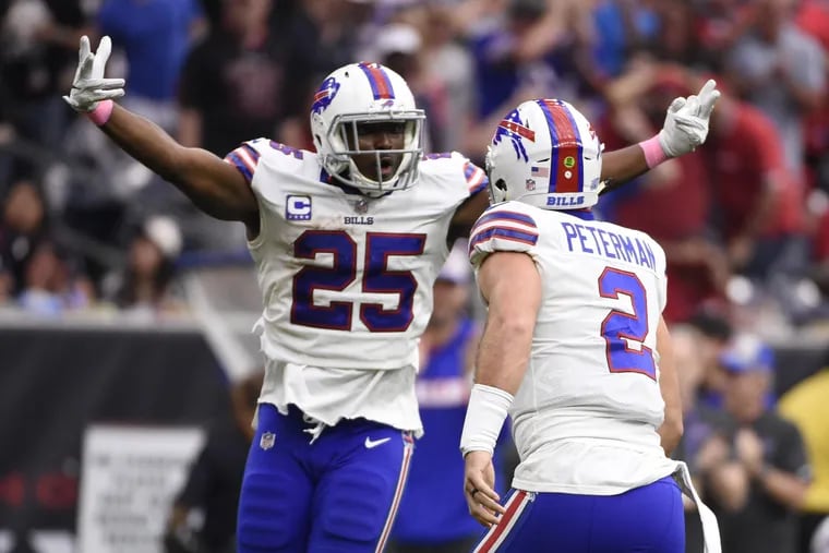 LeSean McCoy (left) celebrates with Nathan Peterman during the Bills' loss in Houston on Sunday.