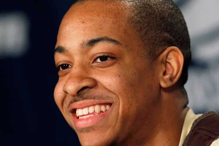 C.J. McCollum answers a question during a news conference in Greensboro, N.C. And it's like he never left. (Gerry Broome/AP File)