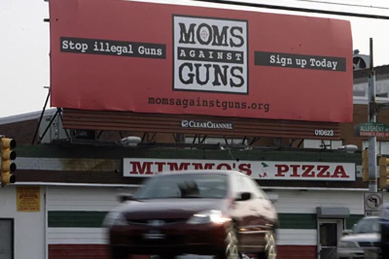The 'Moms against Guns' billboard at 30th and Allegheny in Philadelphia. The space was donated to the group by local advertising firms. (Elizabeth Robertson / Inquirer Staff)