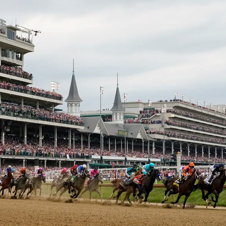 Horses come through the first turn during last year's Kentucky Derby. The 150th Run for the Roses is Saturday at Churchill Downs in Louisville, Ky.
