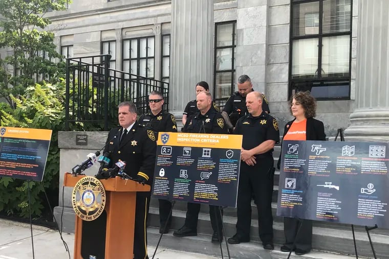 Montgomery County Sheriff Sean Kilkenny (center) announces a new effort by his office to inspect gun stores in the county to ensure they're complying with state and federal law.