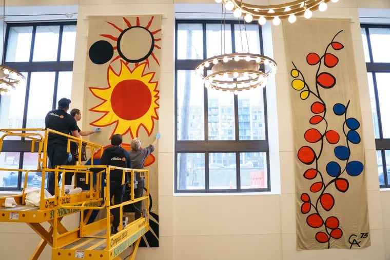 The first two of eight banners created by Alexander Calder in 1975s lost and out of view for most of the last 35 years, are installed at the Free Library of Philadelphia. Six more are slated for exhibition.