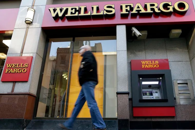 FILE - Wells Fargo ATM in Philadelphia. The bank, with one of the largest branch networks in the city, has been a target of elected officials in recent years but continues to do business with city government. (AP Photo/Matt Rourke, File)