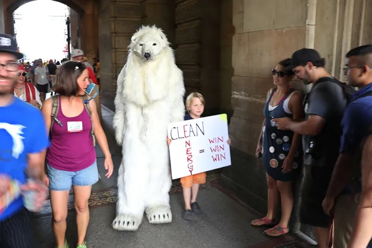 Dressed in a furry polar bear suit despite the heat, Bill Snape of Washington marched from City Hall to Independence Mall. &quot;I'm in much better shape than the polar bears of the Arctic,&quot; he said. &quot;Their habitat is literally melting, melting precipitously.&quot;