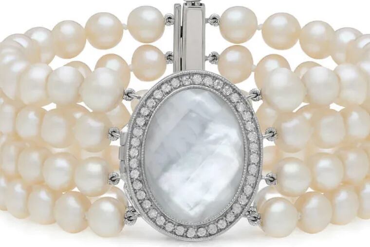 The Claire Bracelet, $329, a sterling-silver locket with mother-of-pearl and quartz doublet and white topaz stones on strands of freshwater pearls. (WithYou Lockets)