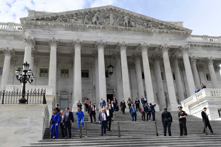 Members of the House of Representatives walk down the steps of Capitol Hill in Washington, Friday, March 27, 2020, after passing a coronavirus rescue package. Columnist Joel Naroff identifies what the CARES act messes up and what it should have been.  (AP Photo/Susan Walsh)
