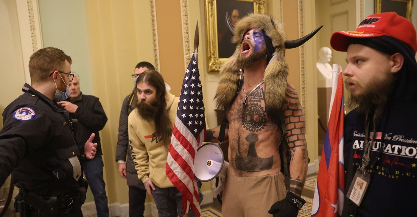 Supporters of President Donald Trump interact with Capitol Police after breaking into the U.S. Capitol during a riot on Wednesday, Jan. 6, 2021, in Washington, D.C.