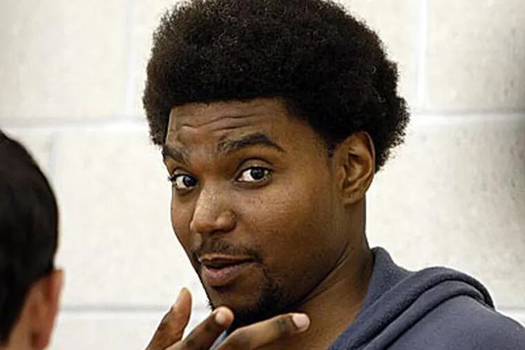 Andrew Bynum waits to talk with reporters after 76ers practice
on Wednesday. (David Maialetti/Staff Photographer)