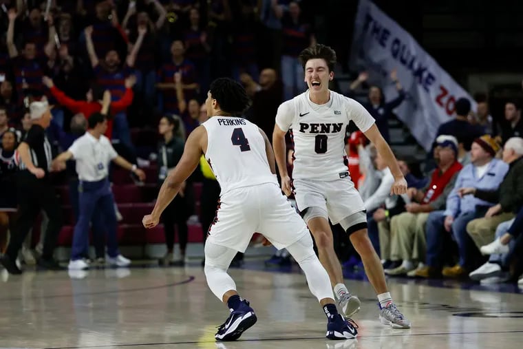 Penn's Clark Slajchert (right) and Tyler Perkins celebrate after hearing they can have athletic scholarships. Really? Nah, they just beat Villanova.