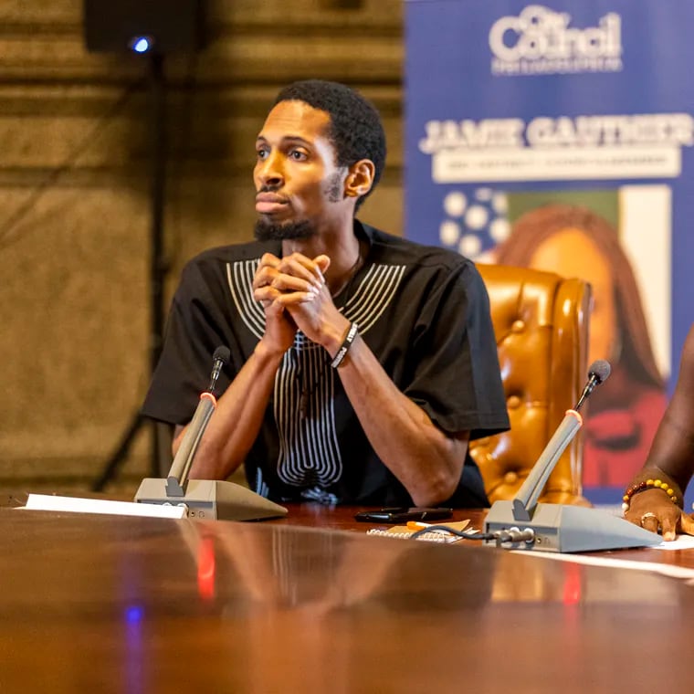 Reparations Task Force Co-Chair’ Breanna Moore, (right), and Rashaun Williams, (left), open up the mic for community members who signed up to speak at the meeting at City Hall in Philadelphia, Pa., on Tuesday, May, 21, 2024.