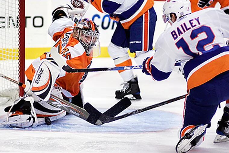 Flyers goalie Sergei Bobrovsky makes a pad save during the first period against the Islanders. (AP Photo/Tom Mihalek)