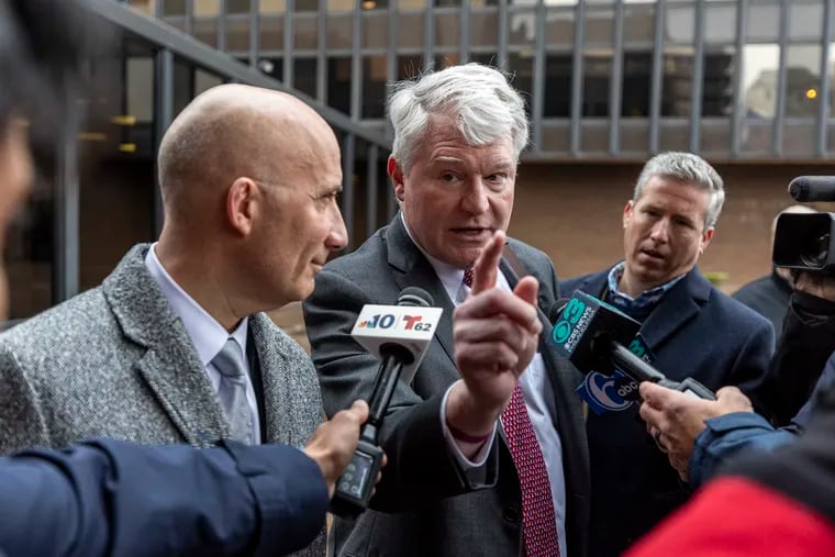 Former labor leader John Dougherty and his lawyer Gregory J. Pagano speak with reporters after his conviction on charges of stealing from the union he led for nearly 30 years outside the federal courthouse in Center City in December.