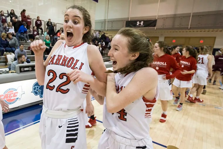 Erin Sweeney, left and Grace O’Neill of Archbishop Carroll  celebrate after they defeated Bonner-Prendergast in the Catholic League girls basketball semifinals.on Feb. 19, 2019.