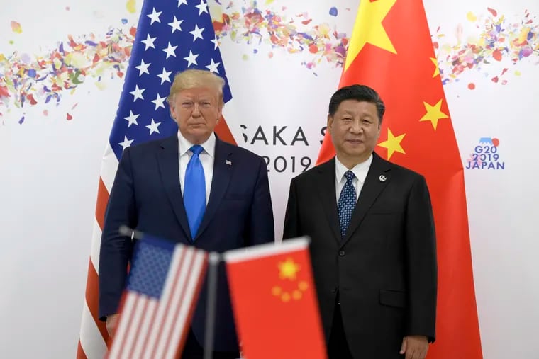 President Donald Trump, left, poses for a photo with Chinese President Xi Jinping during a meeting on the sidelines of the G-20 summit in Osaka, Japan. China has fast become a top election issue as President Donald Trump and Democrat Joe Biden engage in a verbal brawl over who's better at playing the tough guy against Beijing.