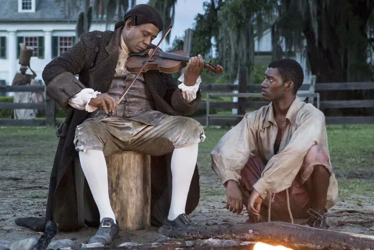 Forest Whitaker, left, and Malachi Kirby play Fidler and Kunta Kinte in History's &quot;Roots&quot; remake. STEVE DIETL / History