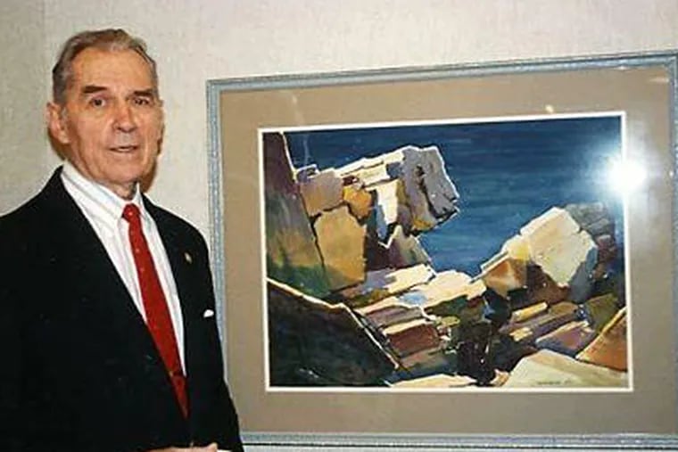 Edward V. Lis with one of his landscapes. He began painting portraits when he was in a work camp in World War II.