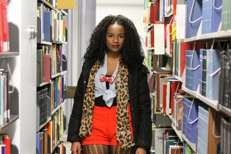 Ninqi Stratton in the library at Temple University in Philadelphia on Friday Dec. 6, 2013. (Stephanie Aaronson/Philly.com)