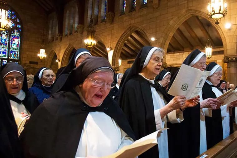 The Dominican Nuns of the Perpetual Rosary attended a farewell mass at their monastery in Camden Monday December 9, 2013. As the mass begins, the nuns join in song. ( ED HILLE / Staff Photographer )