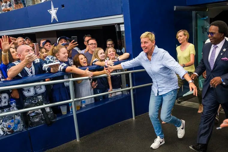 Ellen DeGeneres high-fives fans before an NFL football game between the Dallas Cowboys and the Green Bay Packers on Sunday, Oct. 6, 2019 at AT&T Stadium in Arlington, Texas. (Smiley N. Pool/The Dallas Morning News/TNS)