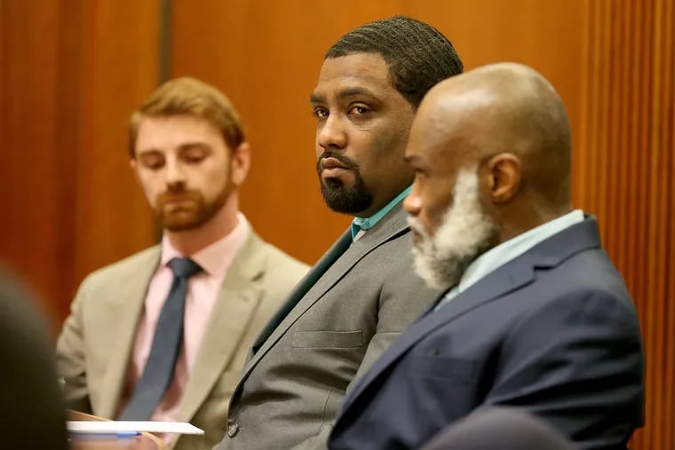 Antoine Ketler, center, and his father, Supreme Life, right, appear in court at the Burlington County Courthouse in Mt. Holly, NJ on March 13, 2019. They were tried for murder and attempted murder for a fight after the Philadelphia Eagles' 2018 Super Bowl victory.