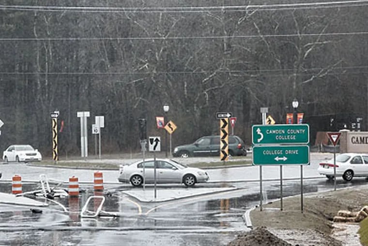 The traffic “roundabout” — more compact and pleasing to the eye than an old-fashioned circle, says one official — mixes traffic at the entrance to Camden County College. (David M Warren / Staff Photographer)