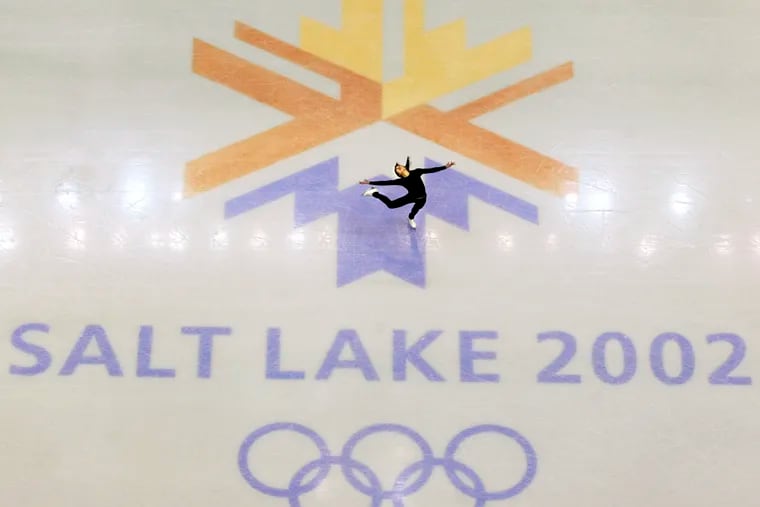 FILE - This Feb. 8, 2002, file photo, shows U.S. champion Michelle Kwan practicing for the women's short program for the Winter Olympic Games at the Salt lake Ice Center in Salt Lake City. Salt Lake City got the green light to bid for an upcoming Winter Olympics most likely for 2030 in an attempt to bring the Games back to the city that hosted in 2002 and provided the backdrop for the U.S. winter team's ascendance into an international powerhouse. (AP Photo/Doug Mills, file)