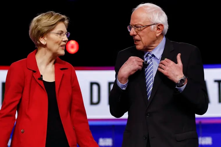 Democratic presidential candidates Sen. Elizabeth Warren (D-Mass.) and Sen. Bernie Sanders (I-Vt.) talk before a Democratic presidential primary debate last month in Charleston, S.C.