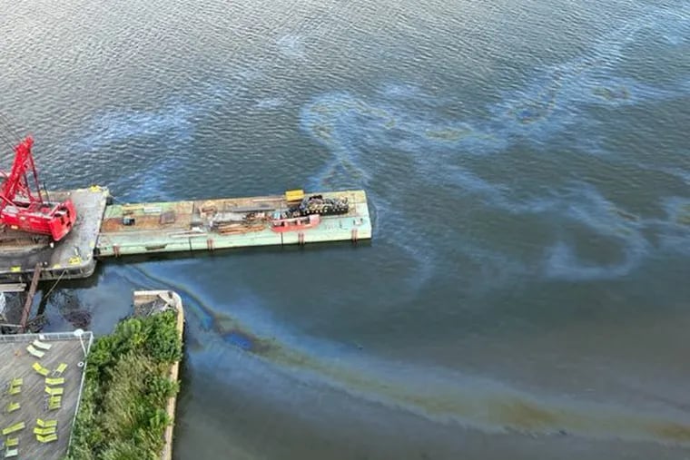 A sheen in front of Philadelphia's old Festival Pier on the Delaware River waterfront as seen from above on Tuesday.