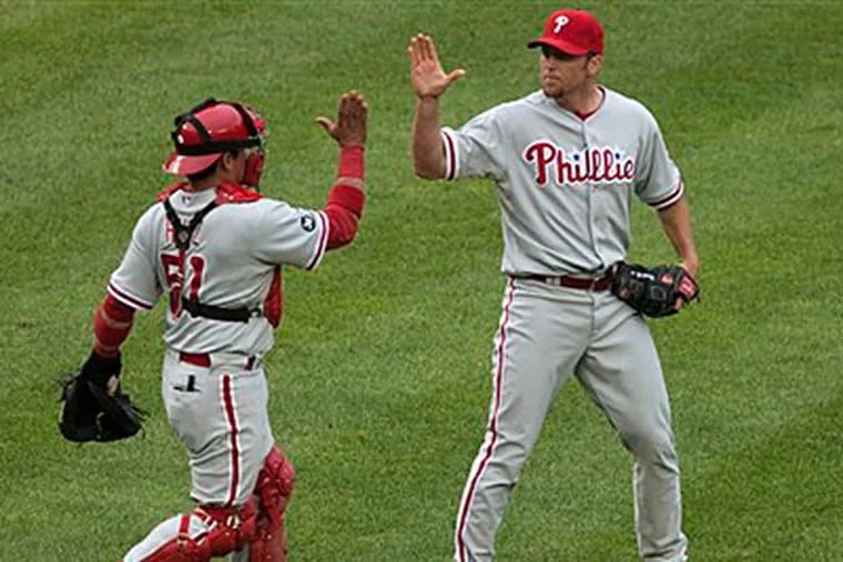 Brad Lidge cruised through the 11th inning, retiring the side in order for the save. (AP Photo/Drew Angerer)