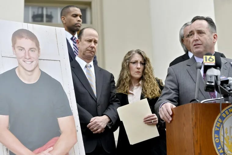 Senate Majority Leader Jake Corman, R-Benner Township, speaks out front of the Centre County Courthouse to introduce anti-hazing legislation named after Timothy Piazza.  Jim and Evelyn Piazza stood with Corman. (Abby Drey/Centre Daily Times/TNS)