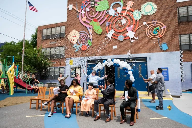 Faculty and students at Chester Arthur Elementary school celebrate with confetti after the school was on a shortlist to be named one of the 10 best schools in the world because of its work reducing suspensions and introducing restorative practices.
