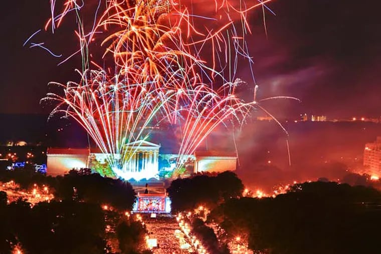Fireworks explode over the Philadelphia Museum of Art, top, in Philadelphia, as thousands line the Benjamin Franklin Parkway.(AP Photo/George Widman, Greater Phila. Tourism M.C.)