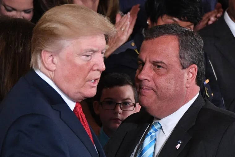 President Donald Trump (left) speaks with Chris Christie, then New Jersey's governor, after he delivered remarks on combating drug demand and the opioid crisis on Oct. 26, 2017 in the East Room of the White House.