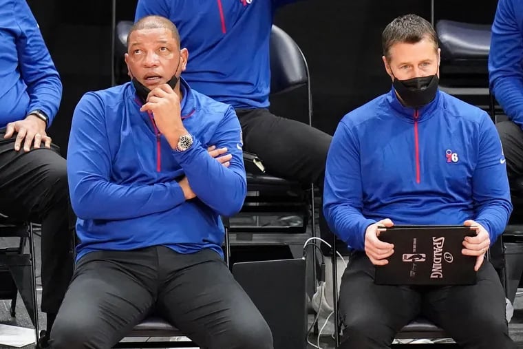 76ers assistant coach Dave Joerger (right) with head coach Doc Rivers.