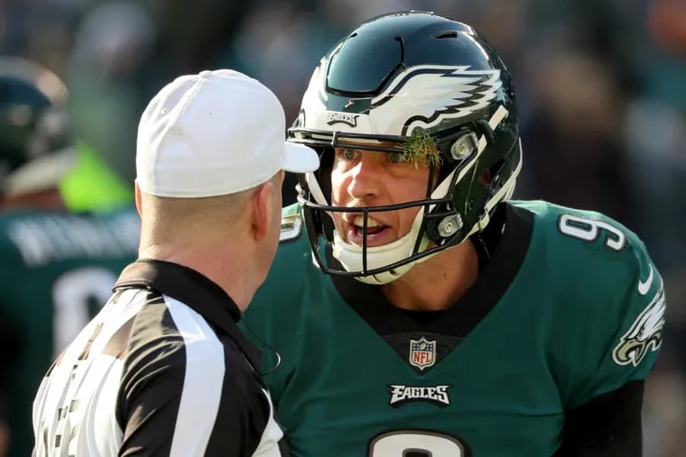 Eagles quarterback Nick Foles, right, argues with referee John Parry,  left, in the 2nd quarter. Philadelphia Eagles play the Houston Texans in Philadelphia, PA on December 23, 2018. Files was looking for a face mask call.  DAVID MAIALETTI / Staff Photographer