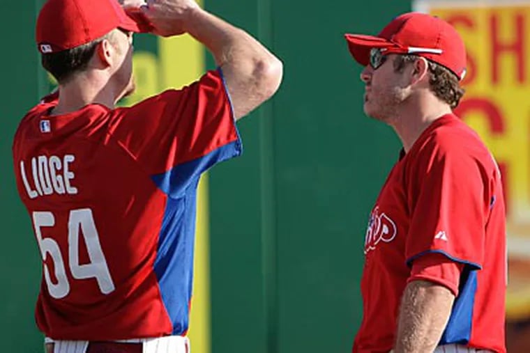 Brad Lidge and Chase Utley are expected to start the season on the disabled list. (David Maialetti/Staff Photographer)