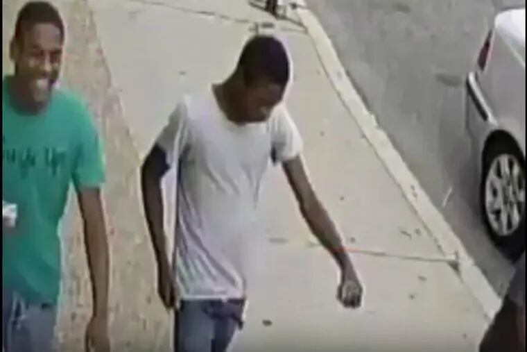 The male in the white T-shirt is accused of throwing an explosive device into the New Dragon City takeout restaurant on the 500 block of Washington Avenue in Queen Village at about 5:30 p.m. Aug. 12, 2017. He was in a group of several other males at the time.