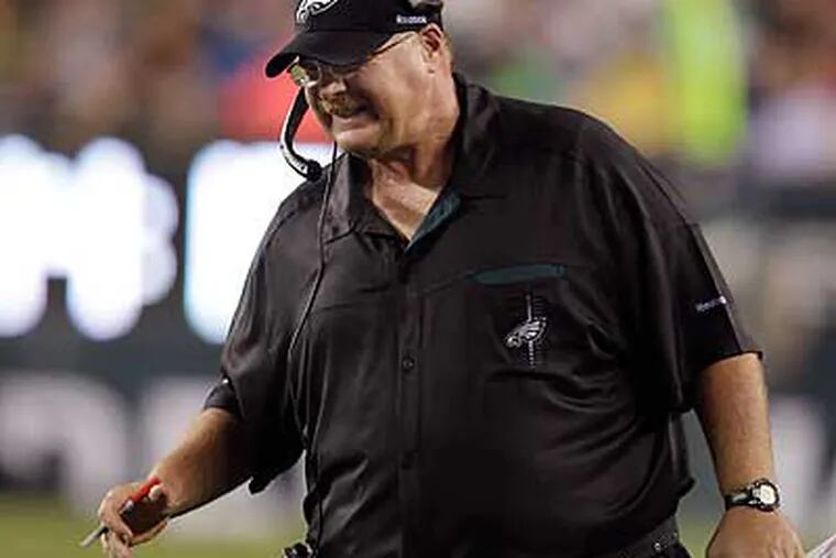 Andy Reid's poor clock management has been a factor in many close Eagles losses. (David Maialetti/Staff Photographer)