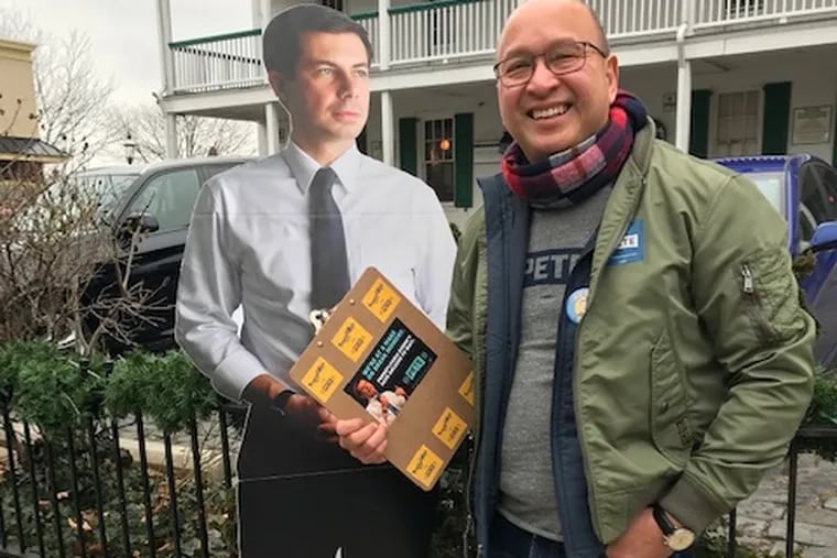 Jobert Abuevo, a delegate for Mayor Pete Buttigieg, collecting petition signatures in Doylestown.