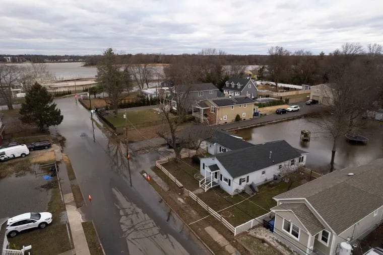 Floodwaters remain on Alden Avenue in Delran, NJ on Wednesday, Jan. 10, 2024. A significant winter storm moved through the Philadelphia area Tuesday and overnight, sweeping heavy rains and strong winds across the region.